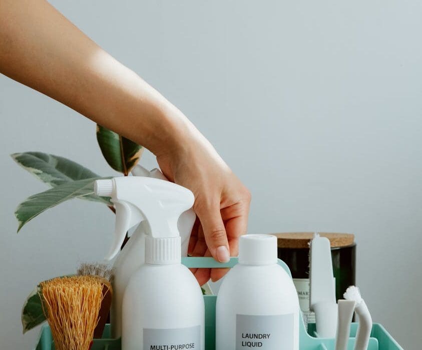 hand picking up self care products organizer